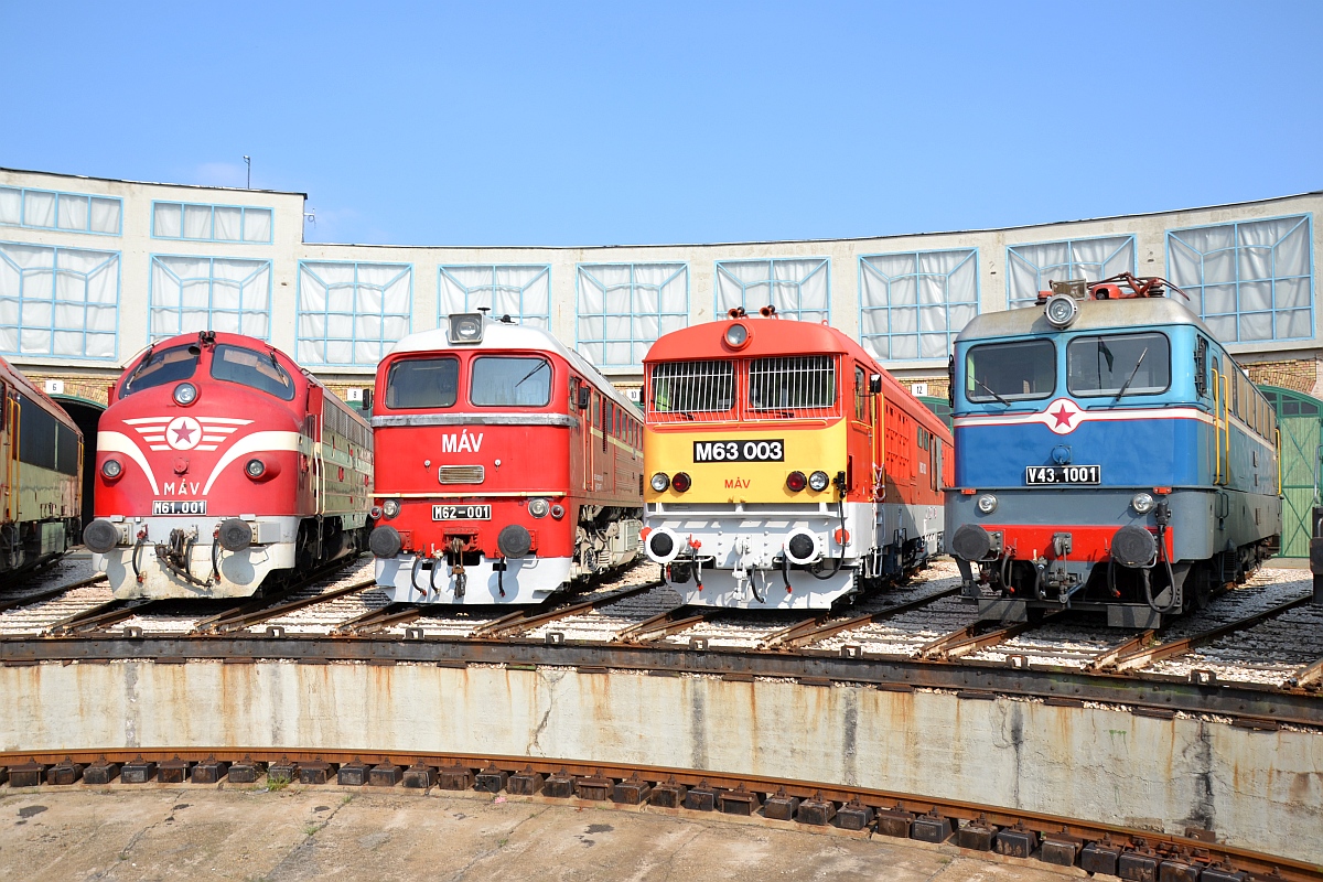 three unused train cars on display
